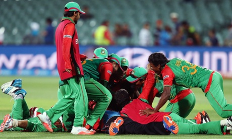 Bangladesh players celebrate after beating England.