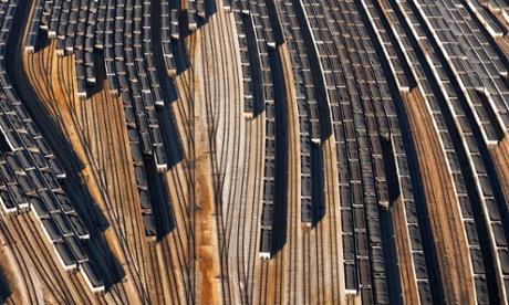 Aerial view of coal trains, tracks and port along river, Newport, Virginia, USA