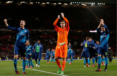 Arsenal's Per Mertesacker, Wojciech Szczesny and Olivier Giroud applaud the 9,000 travelling fans.