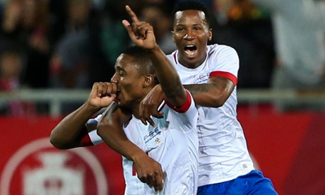 Gege, left, of Cape Verde celebrates scoring against Portugal.