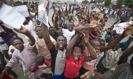 Supporters of opposition candidate Muhammadu Buhari celebrate his anticipated victory  in Kano.