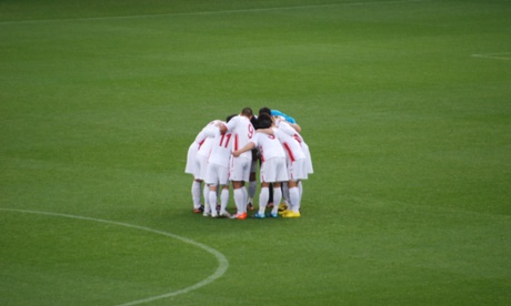 The North Korean team huddle before their match against Portugal in 2010.