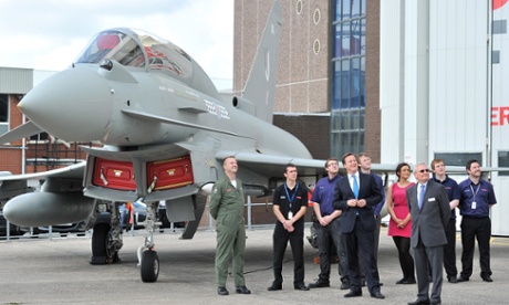 David Cameron watches a Eurofighter Typhoon during a visit to BAE Systems in Warton, Lancashire.