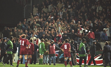 Some of the England and Republic of Ireland players watch as the 1995 match in Dublin is abandoned