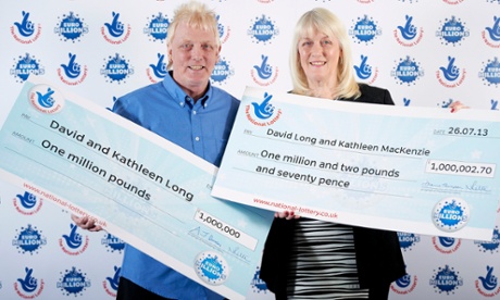 David and Kathleen Long with their cheques after winning £1m in the EuroMillions for the second time in two years.