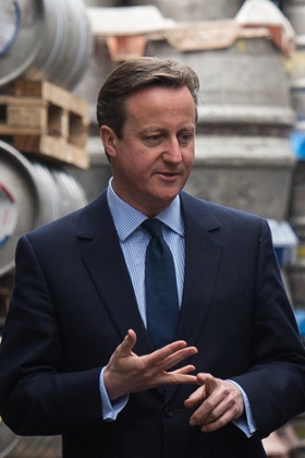 Britain's Prime Minister David Cameron and Chancellor of the Exchequer George Osborne, right, visit the Marston's Brewery in Wolverhampton, England, Wednesday April 1, 2015. Britain goes to the polls for a general election on Thursday May 7, 2015. (AP Photo/Leon Neal, Pool)