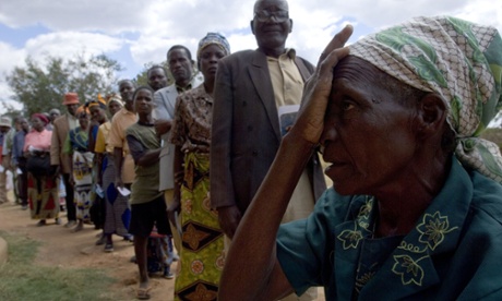Financing strategies must support the move towards universal healthcare … people wait for eye tests at a clinic in Makande, Malawi. 