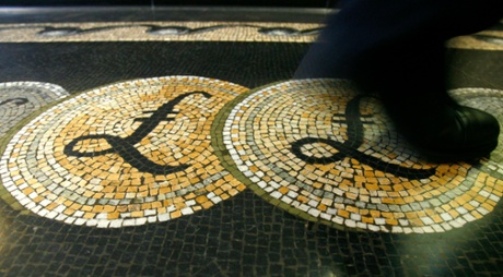 A mosaic of pound sterling symbols set in the floor of the front hall of the Bank of England.
