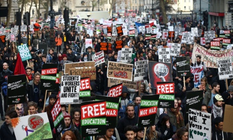 Students take part in a protest march against fees and cuts in the education system in London.