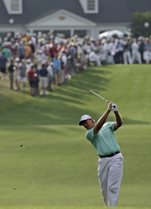 Ernie Els plays his approach to the first.