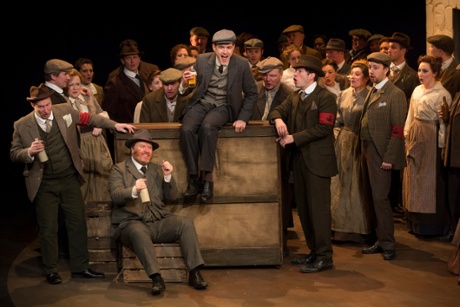 Sam Furness as Steva with chorus of Scottish Opera in Jenufa.