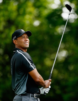 Tiger Woods watches his tee shot.