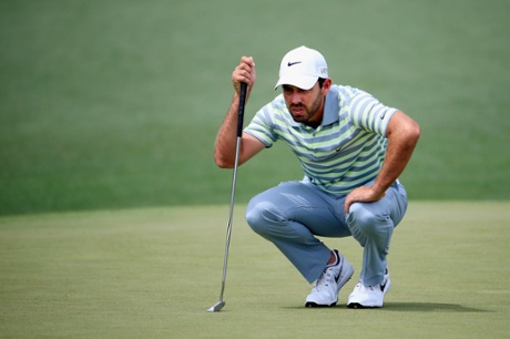 Charl Schwartzel lines up a putt.