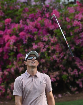 Justin Rose throws his club on the 13th.
