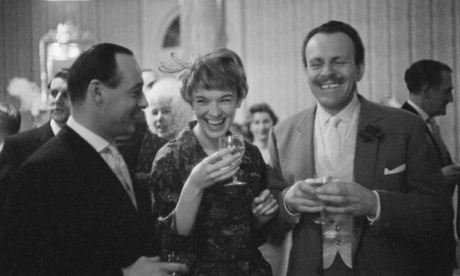 Terry-Thomas (1911 - 1990) (right) shares a joke with British speed record breaker Donald Campbell (1921 - 1967) and singer Tonia Bern during their wedding reception.