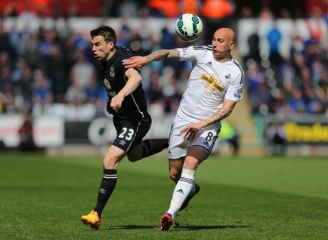 Seamus Coleman and Jonjo Shelvey battle for the ball.