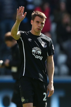Seamus Coleman holds his hand up to the away fans at full time.