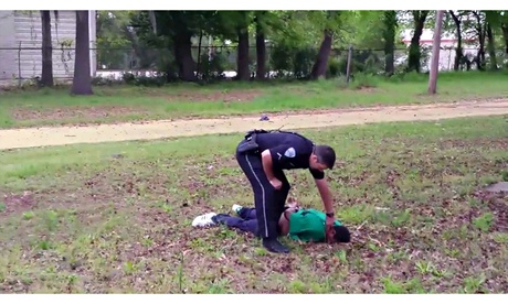 Michael Slager stands over Walter Scott.