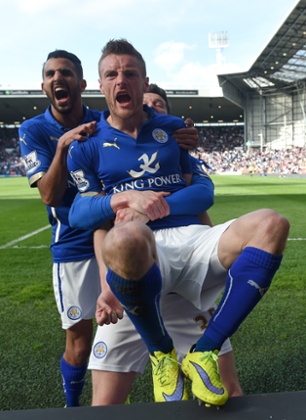 Jamie Vardy celebrates scoring the third goal with team mates.