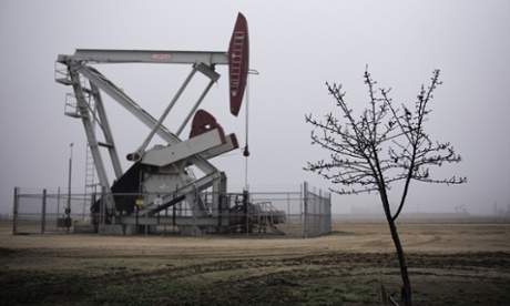 Almond tree in front of a pumpjack