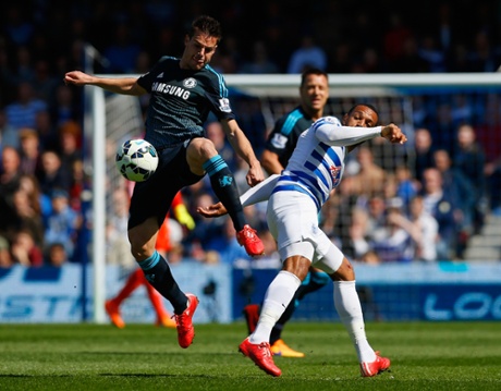 Cesar Azpilicueta and Matt Philips battle for the ball.