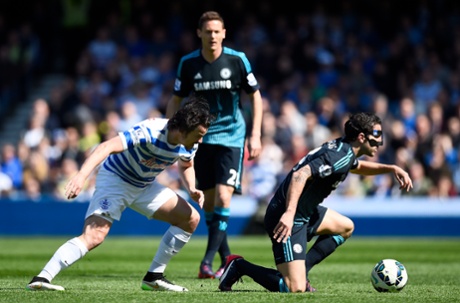 Cesc Fabregas receoves a tackle from Joey Barton.