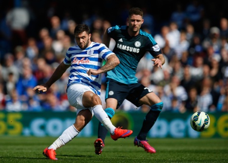 Charlie Austin shoots under pressure from Gary Cahill.