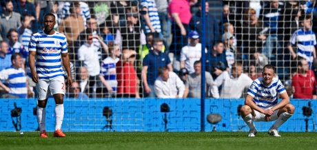 Clint Hill and David Hoilett, dejected after the Fabregas goal.