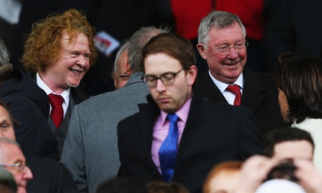 MANCHESTER, ENGLAND - APRIL 12:  Sir Alex Ferguson and musician Mick Hucknall look on prior to the Barclays Premier League match between Manchester United and Manchester City at Old Trafford on April 12, 2015 in Manchester, England.  (Photo by Alex Livesey/Getty Images)English Premier LeagueFootballSoccerClub SoccerEnglish Soccer ClubBallTeam Sport
