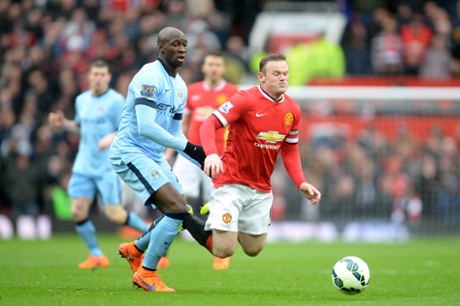 Wayne Rooney goes down under a challenge from Eliaquim Mangala.