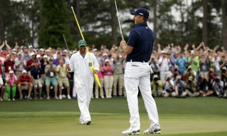 Jordan Spieth celebrates as his putt falls into the cup.
