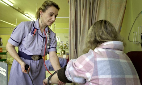 A nurse with a patient in a hospital