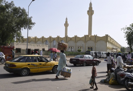 People walk near the Central Mosque in N’Djamena.