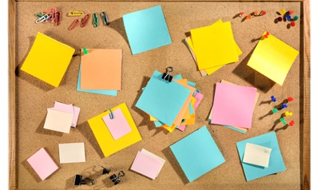 Post it notes on a notice board
