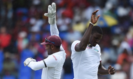 The impressive Jason Holder celebrates with West Indies captain and wicketkeeper Denesh Ramdin after taking the wicket of Gary Ballance.