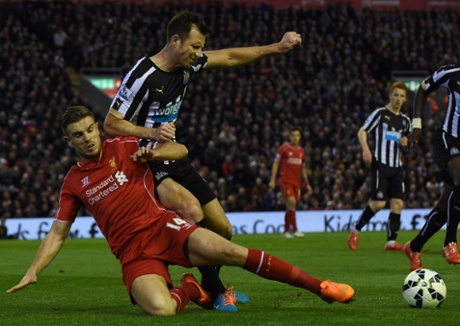 Jordan Henderson battles with Mike Williamson at Anfield as Liverpool take control against a fragile Newcastle.