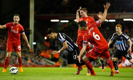 Ayoze Perez is floored by a reckless challenge in the area by Liverpool's Dejan Lovren, nothing given.
