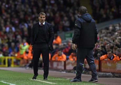 Brendan Rodgers and John Carver exchange views.