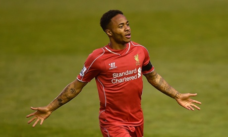 Raheem Sterling celebrates after curling the ball into the back of the net.