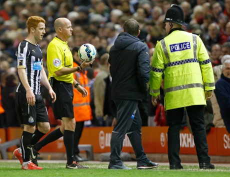 Newcastle's Jack Colback and manager John Carver speak with referee Lee Mason as they walk off.