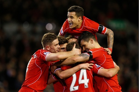 Philippe Coutinho celebrates with his team-mates after Joe Allen scored Liverpool's second.