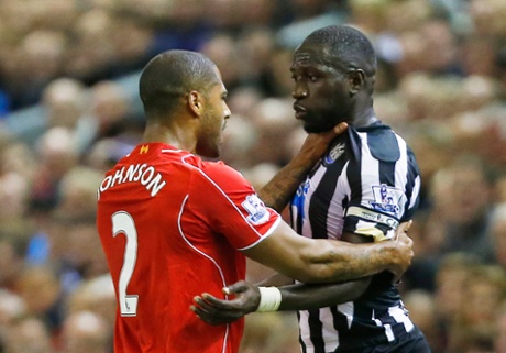 Moussa Sissoko and Glen Johnson square up.