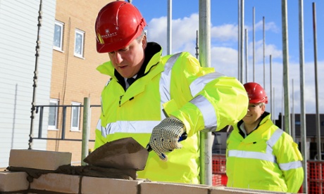 David Cameron laying bricks.