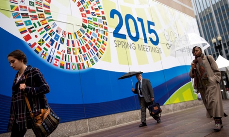 epa04704068 Pedestrians walk by the International Monetary Fund (IMF) headquarters during the 2015 IMF and World Bank Group Spring Meetings, in Washington, DC, USA, 14 April 2015. The meetings run through 19 April.  EPA/SHAWN THEW