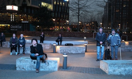 People watching the live leaders' TV debate on a big screen outside the ITV Studios in Salford Quays, Greater Manchester.