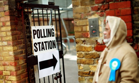 People arrive to cast their votes at a polling station in Tower Hamlets, east London.
