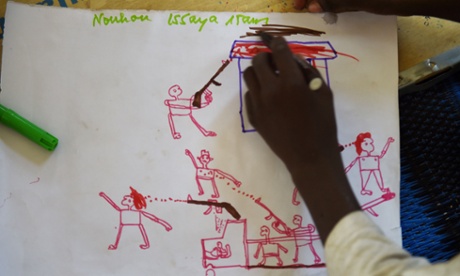 Young Nigerian refugees draw on April 6, 2015 during a therapy program managed by UNICEF in a refugee camp near Baga Sola. Bloody faces, headless bodies, burned houses -- just some of the stark and haunting images drawn by children who have fled deadly Boko Haram violence in neighbouring Nigeria for the relative safety of a refugee camp in western Chad.