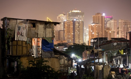 A shanty town and sky scrapers in Manila