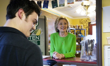 Former U.S. Secretary of State Hillary Clinton talks with local residents as she campaigns at the Jones Street Java House in LeClaire, Iowa April 14, 2015.