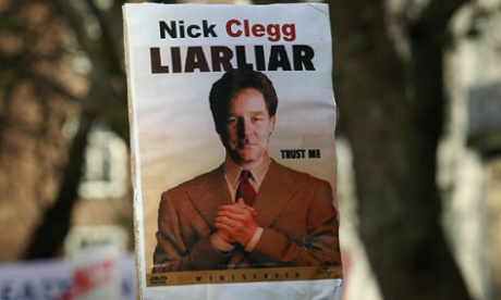 A poster of Nick Clegg is displayed on a placard held by a student demonstrator on 9 December 2010 in London as parliament voted on whether to implement the coalition government's proposals to increase university tuition fees.